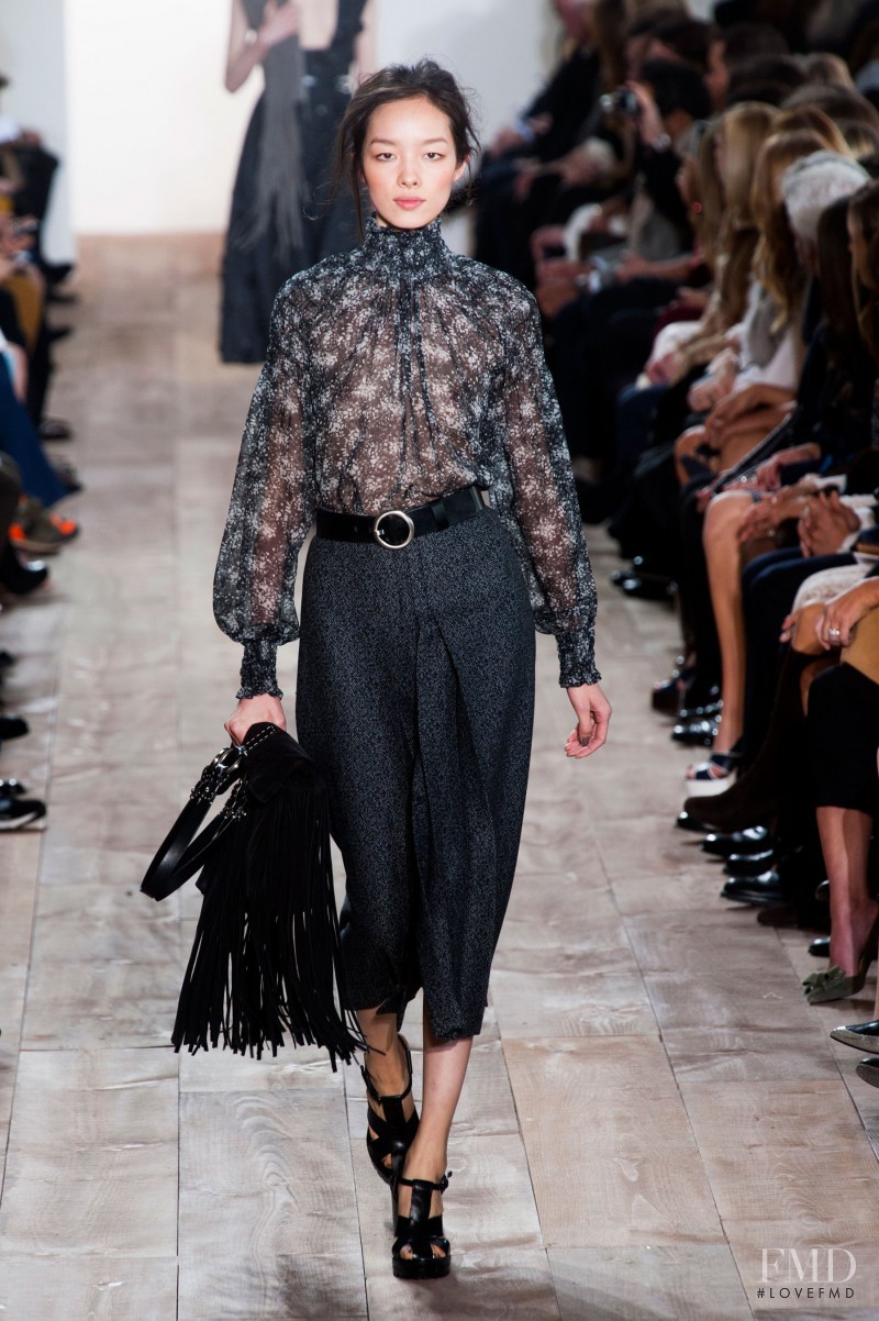 Fei Fei Sun featured in  the Michael Kors Collection fashion show for Autumn/Winter 2014