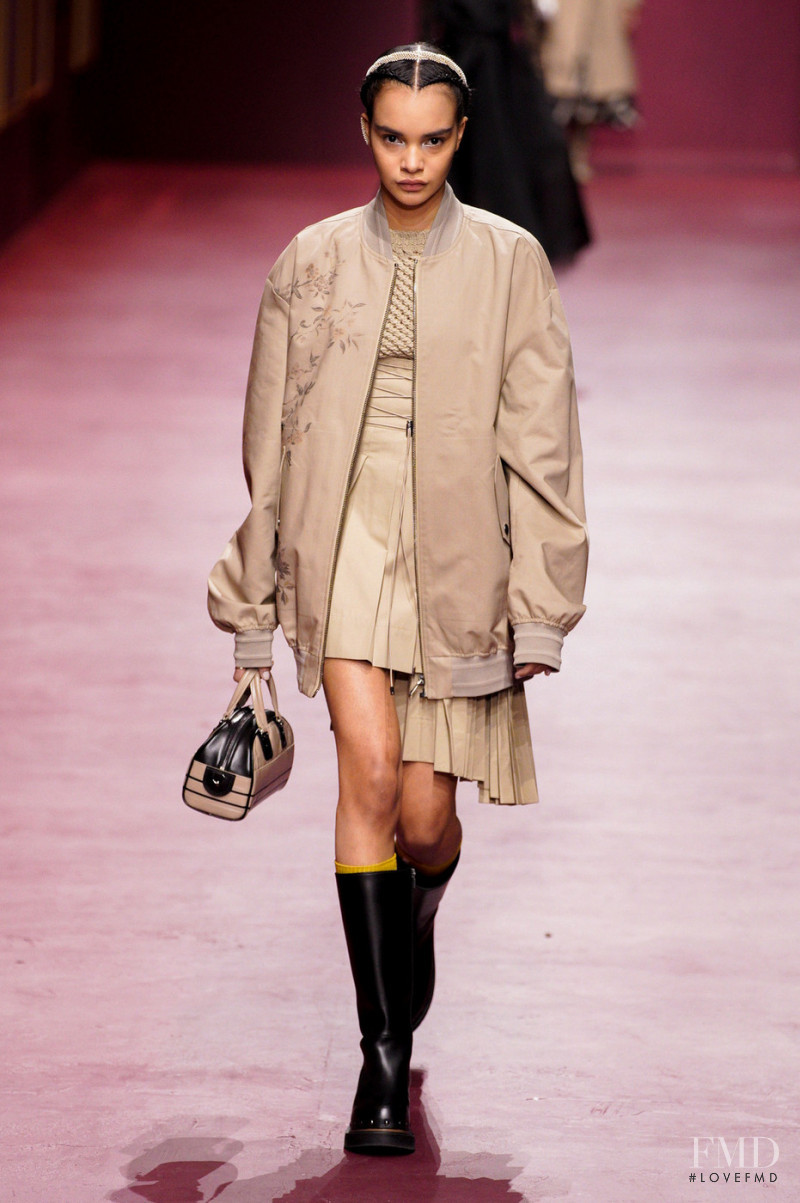 Naomi Ekindi Dioh featured in  the Christian Dior fashion show for Autumn/Winter 2022