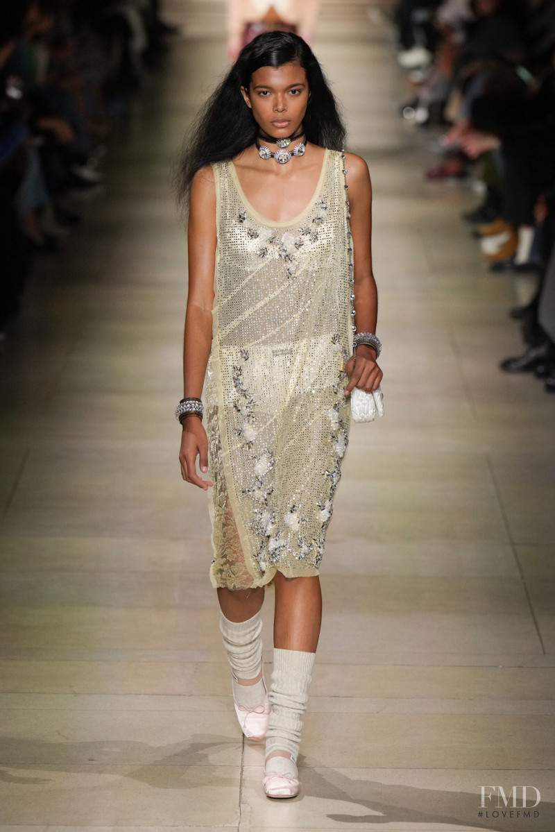 Livia Eduarda featured in  the Miu Miu fashion show for Autumn/Winter 2022