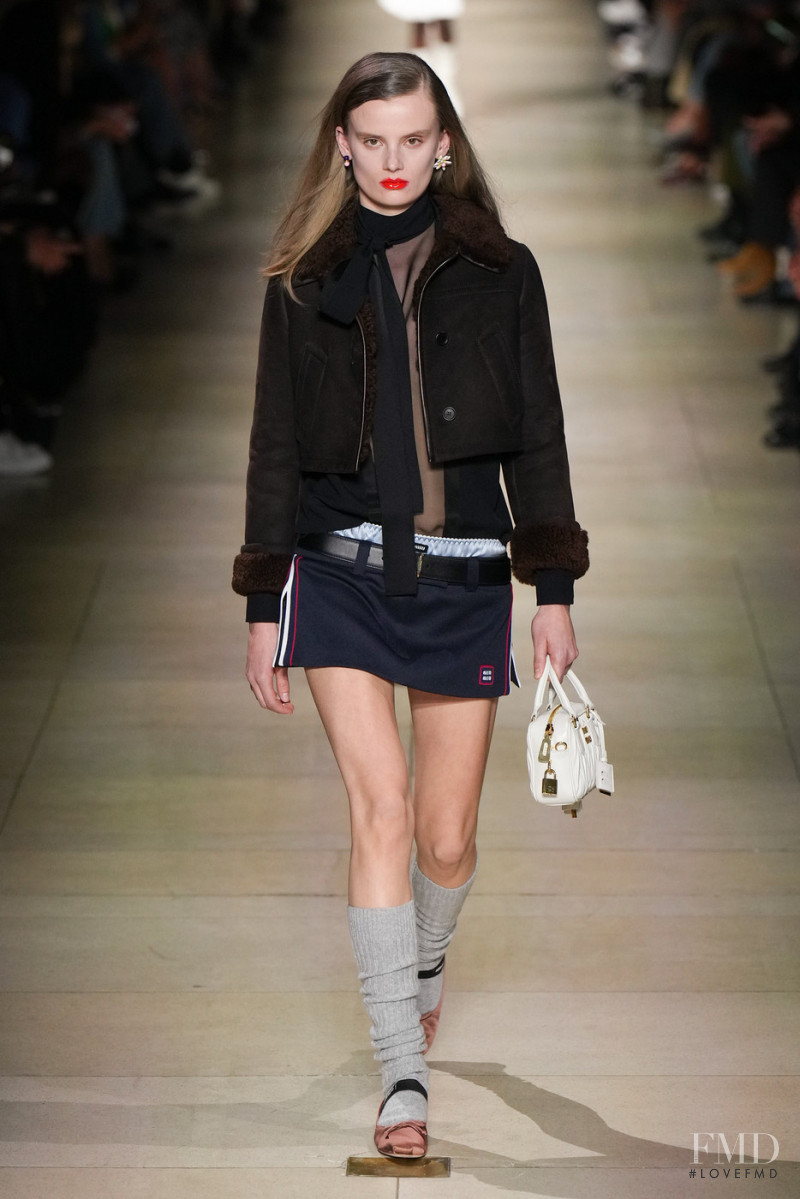 Evie Saunders featured in  the Miu Miu fashion show for Autumn/Winter 2022