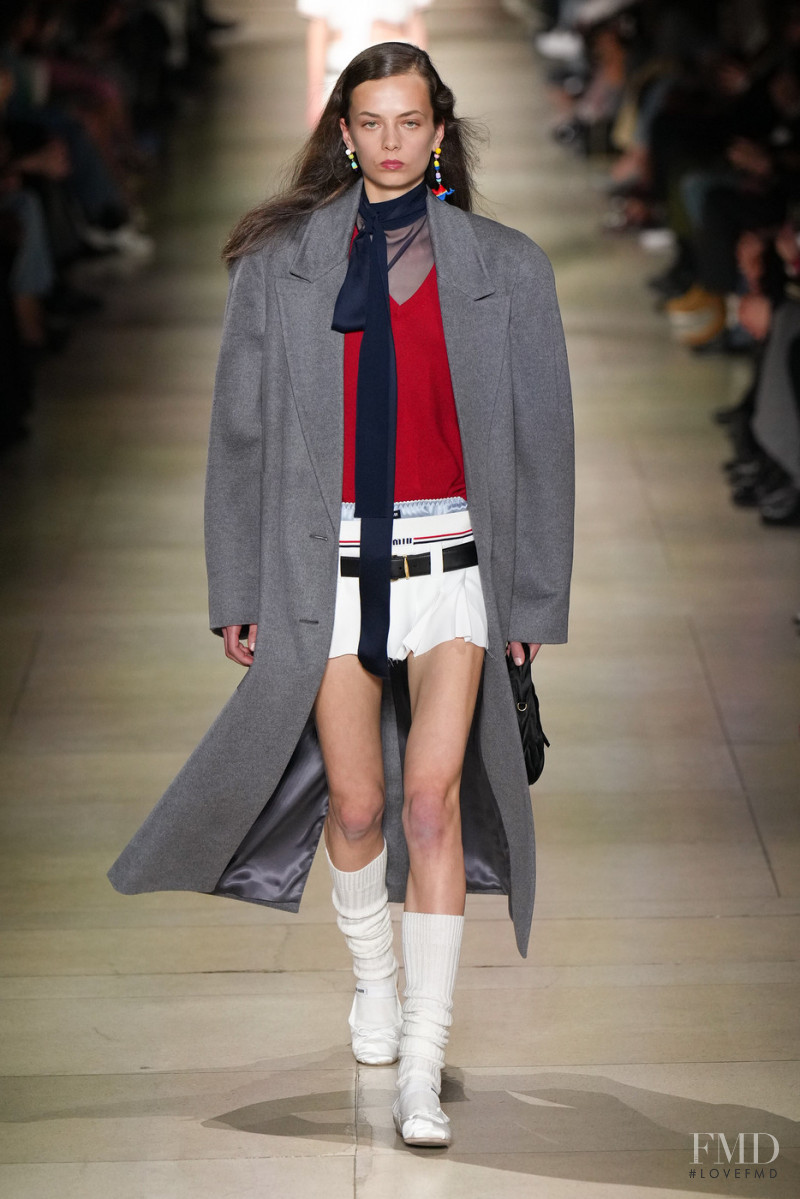 Nina Pronk featured in  the Miu Miu fashion show for Autumn/Winter 2022
