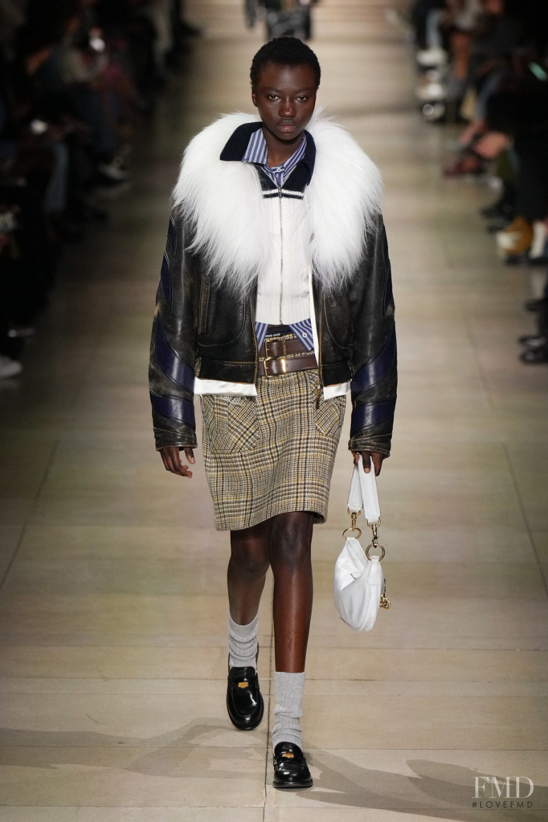 Anyiang Yak featured in  the Miu Miu fashion show for Autumn/Winter 2022