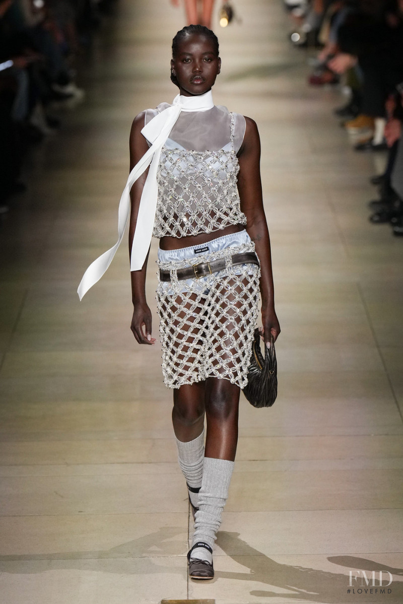 Adut Akech Bior featured in  the Miu Miu fashion show for Autumn/Winter 2022