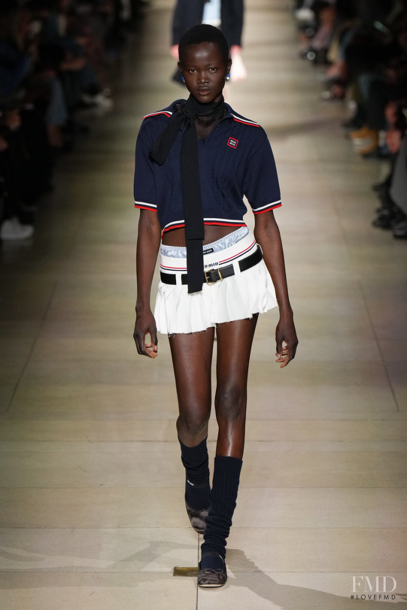 Anyiel Majok featured in  the Miu Miu fashion show for Autumn/Winter 2022