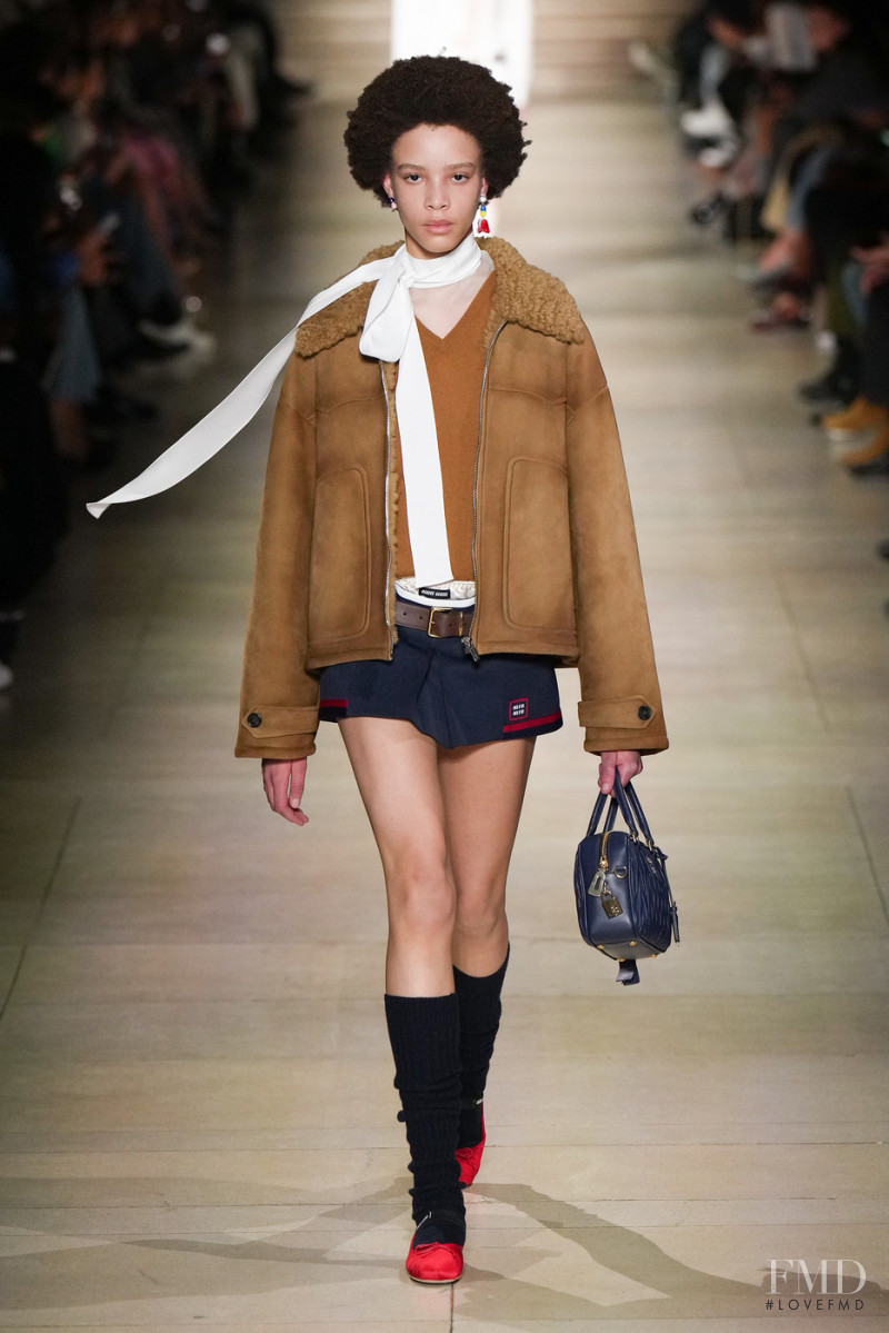 Essoye Mombot featured in  the Miu Miu fashion show for Autumn/Winter 2022