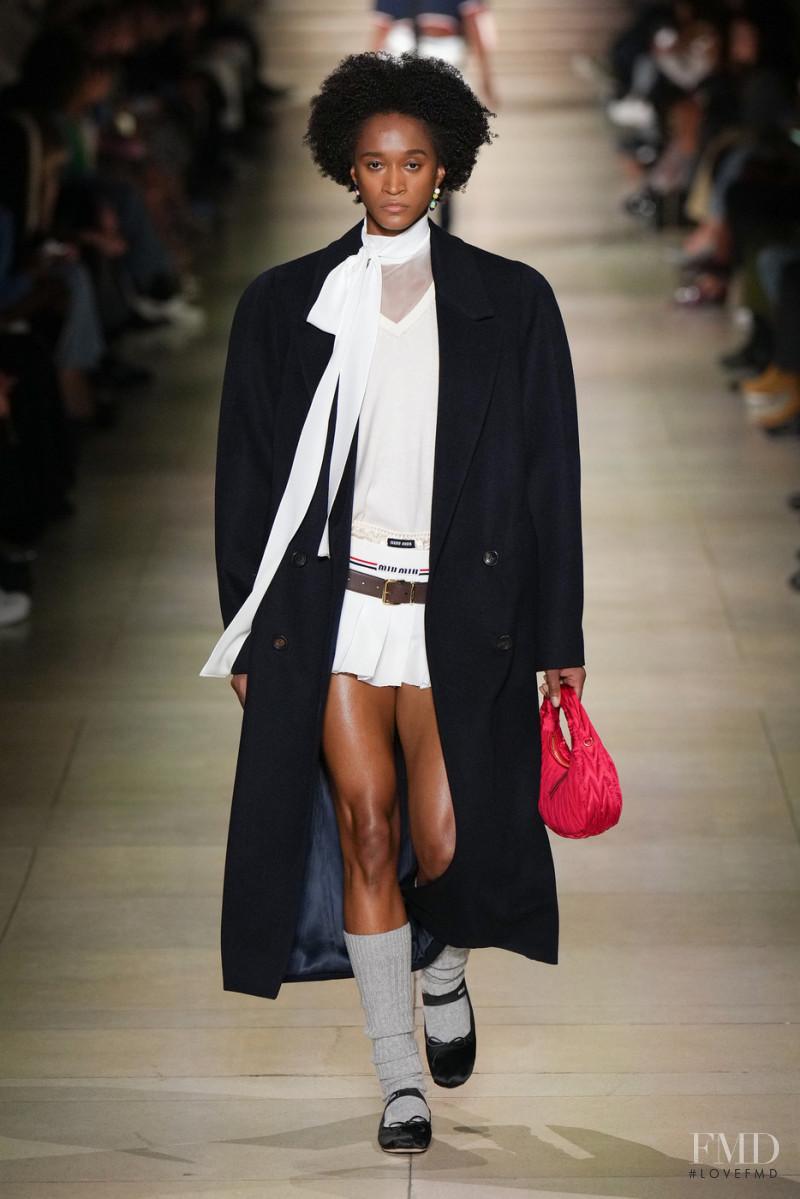 Kendall Baisden featured in  the Miu Miu fashion show for Autumn/Winter 2022