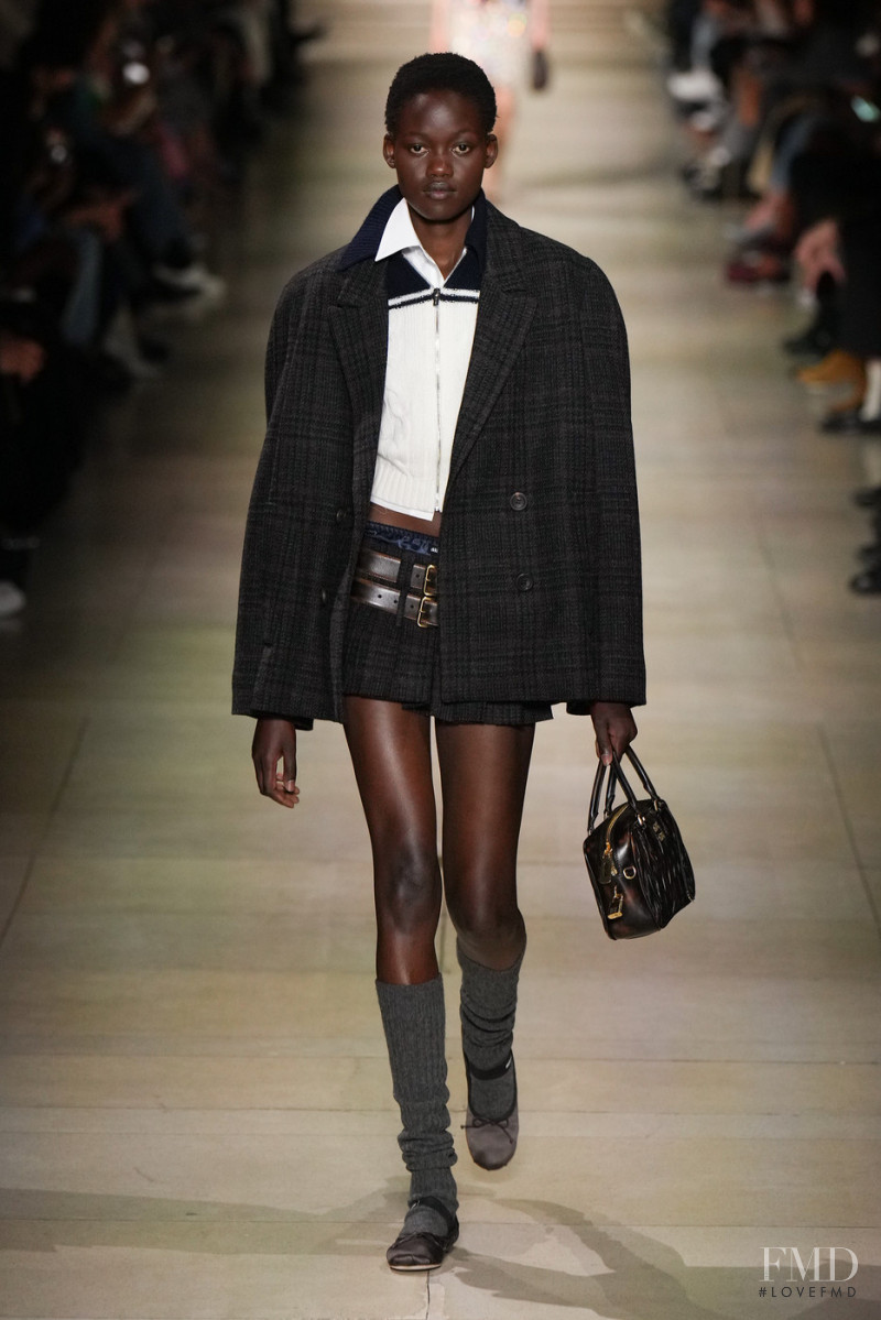 Caren Jepkemei featured in  the Miu Miu fashion show for Autumn/Winter 2022