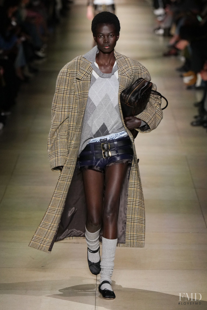 Mammina Aker featured in  the Miu Miu fashion show for Autumn/Winter 2022