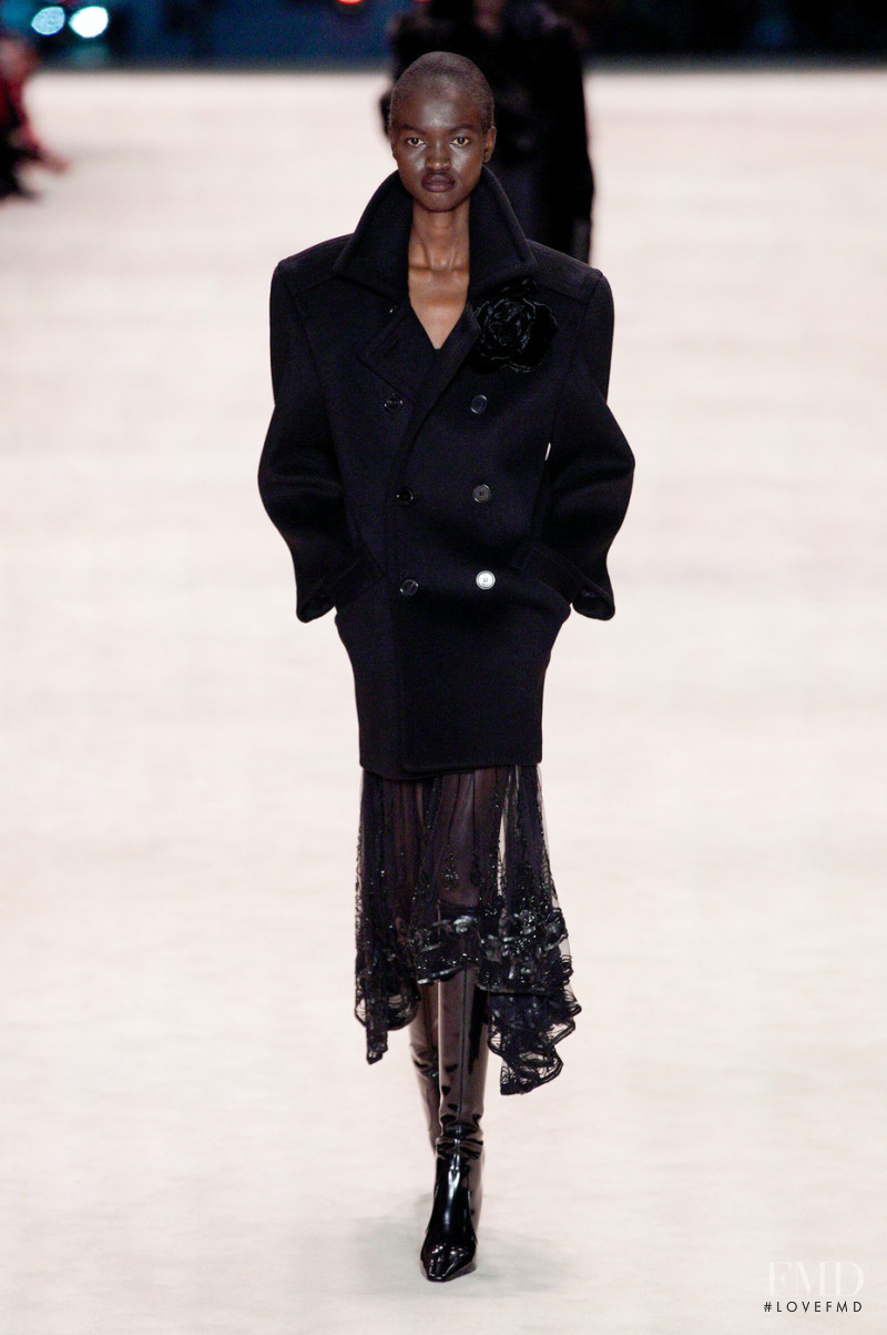 Diana Achan featured in  the Saint Laurent fashion show for Autumn/Winter 2022