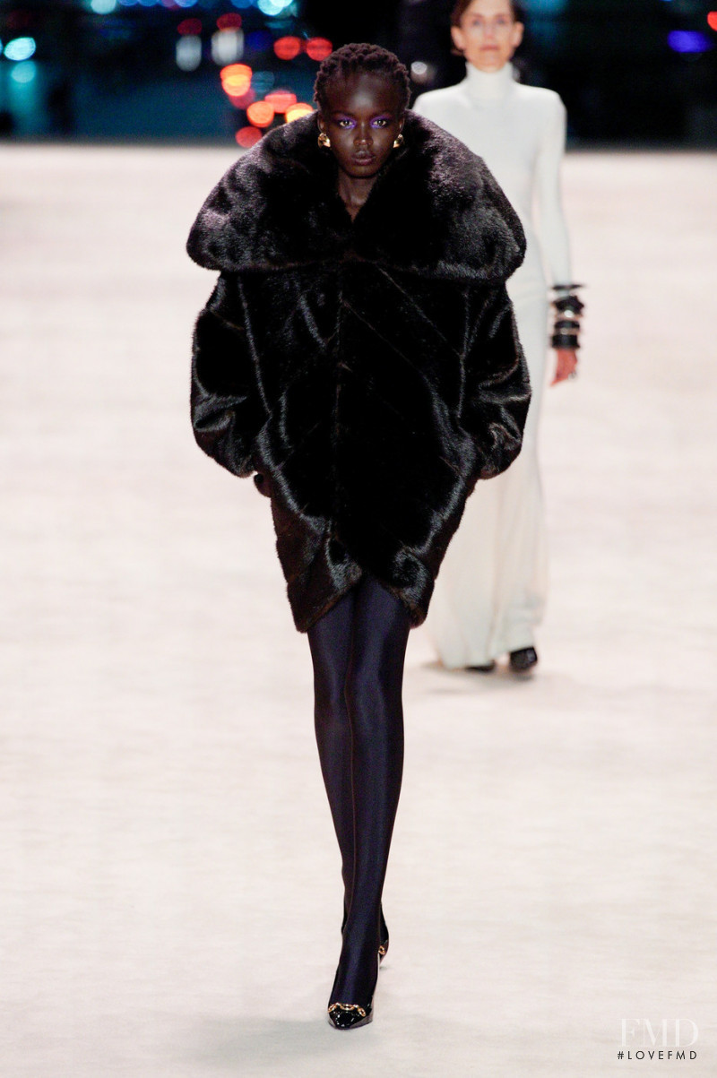 Anyier Anei featured in  the Saint Laurent fashion show for Autumn/Winter 2022