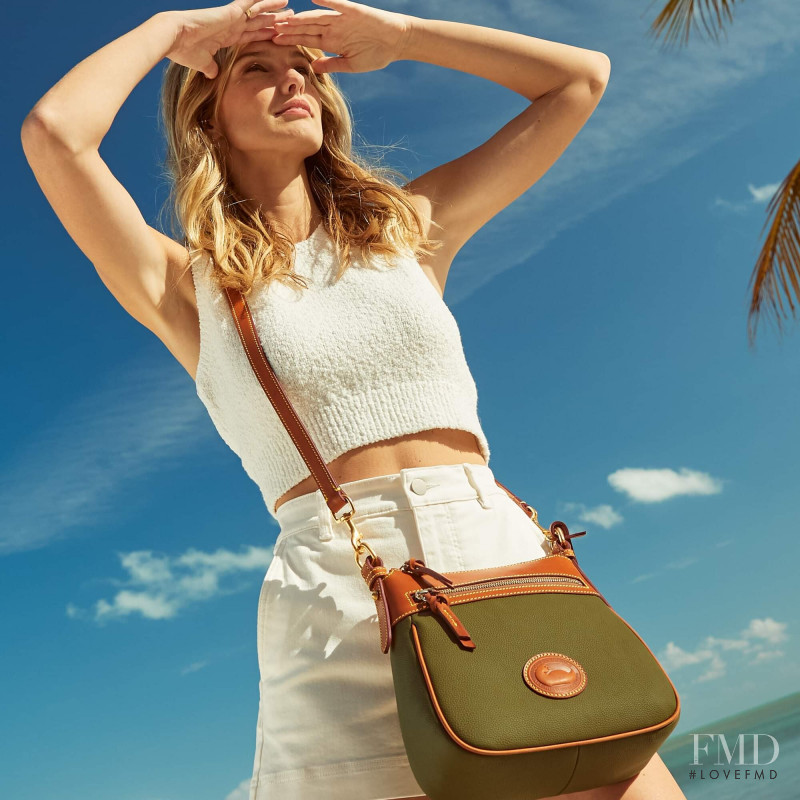 Brooke Lynn Buchanan featured in  the Dooney & Bourke advertisement for Spring/Summer 2022