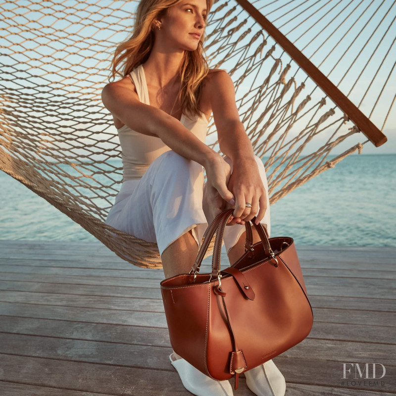 Brooke Lynn Buchanan featured in  the Dooney & Bourke advertisement for Spring/Summer 2022