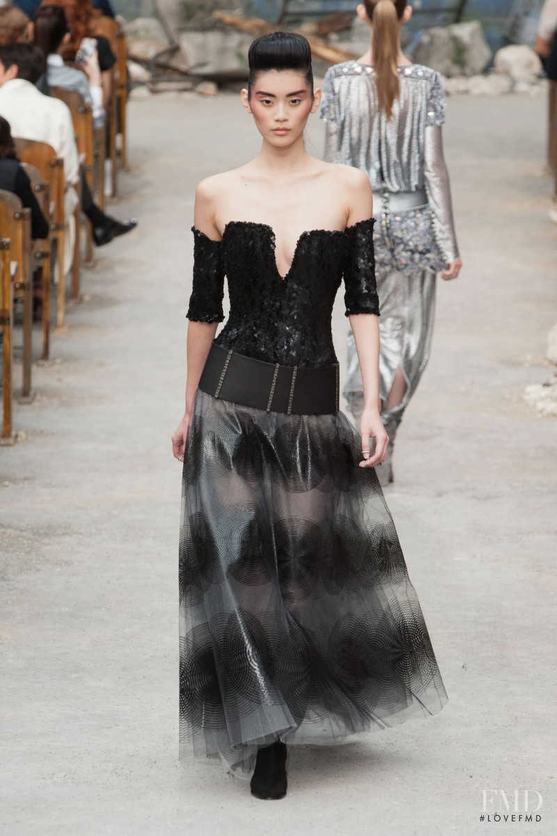 Ming Xi featured in  the Chanel Haute Couture fashion show for Autumn/Winter 2013