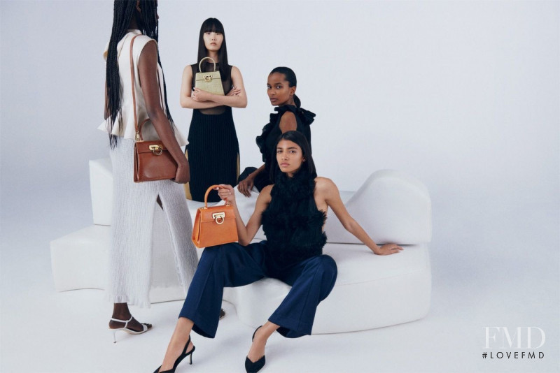 Achan Biong featured in  the Salvatore Ferragamo Top Handle Bag advertisement for Spring/Summer 2022