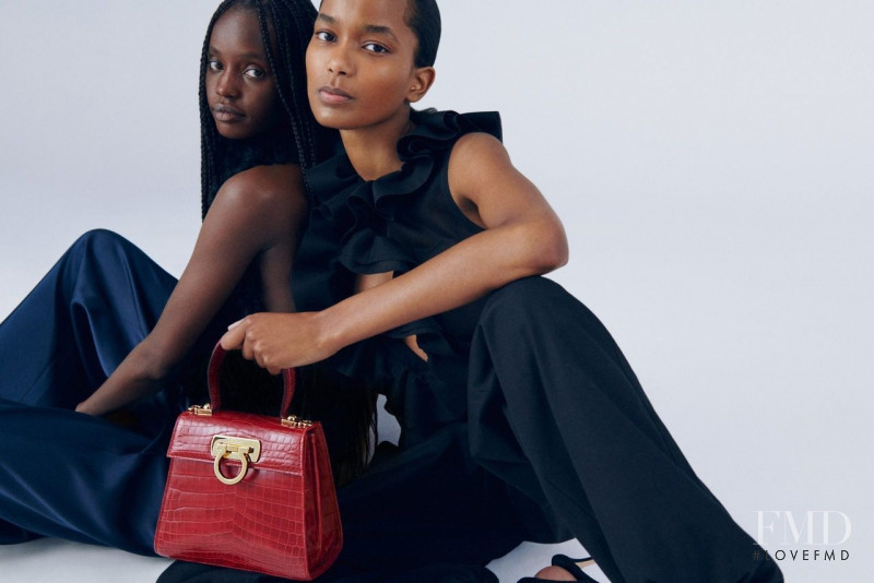 Achan Biong featured in  the Salvatore Ferragamo Top Handle Bag advertisement for Spring/Summer 2022