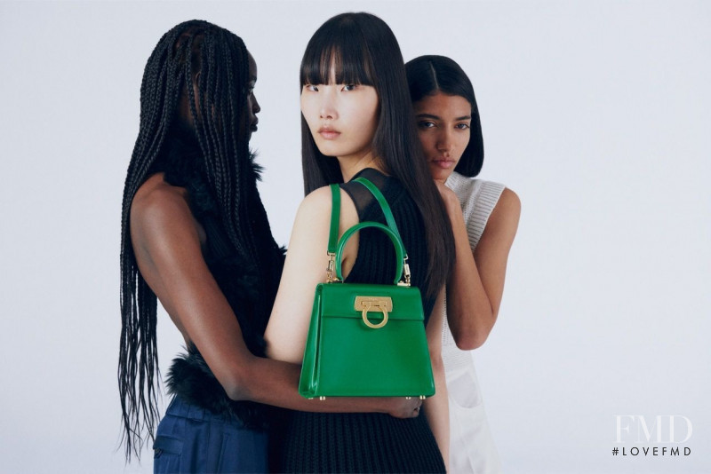 Achan Biong featured in  the Salvatore Ferragamo Top Handle Bag advertisement for Spring/Summer 2022