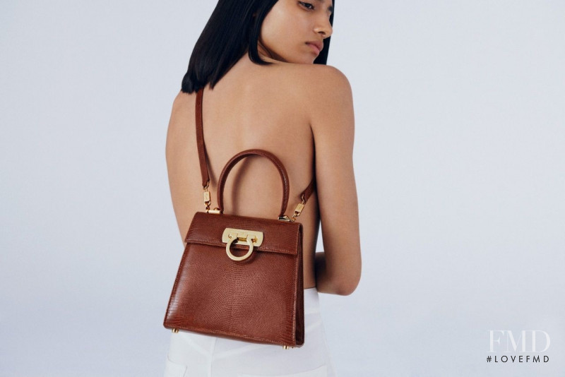 Maria Khan featured in  the Salvatore Ferragamo Top Handle Bag advertisement for Spring/Summer 2022