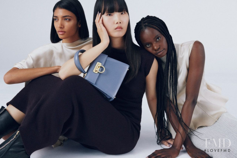 Achan Biong featured in  the Salvatore Ferragamo Top Handle Bag advertisement for Spring/Summer 2022