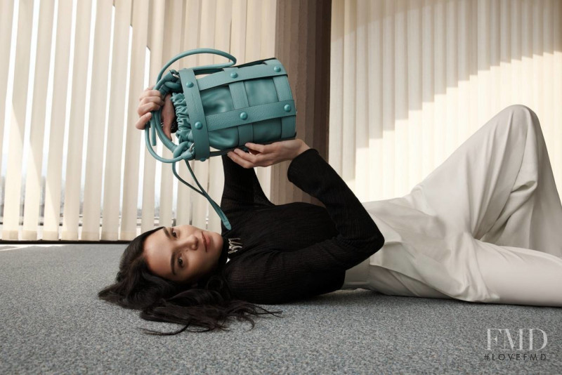 Mariacarla Boscono featured in  the Salvatore Ferragamo Cage Bag advertisement for Spring 2022