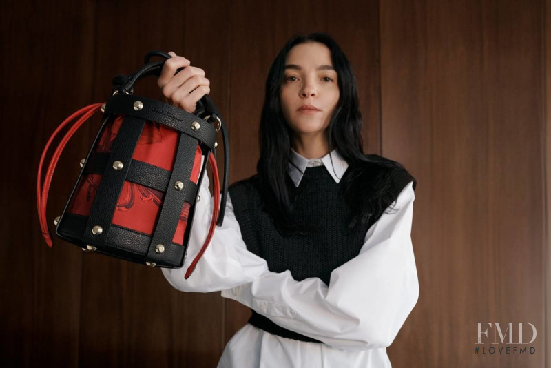 Mariacarla Boscono featured in  the Salvatore Ferragamo Cage Bag advertisement for Spring 2022