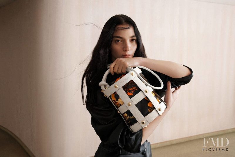 Mariacarla Boscono featured in  the Salvatore Ferragamo Cage Bag advertisement for Spring 2022