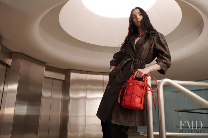 Mariacarla Boscono featured in  the Salvatore Ferragamo Cage Bag advertisement for Spring 2022