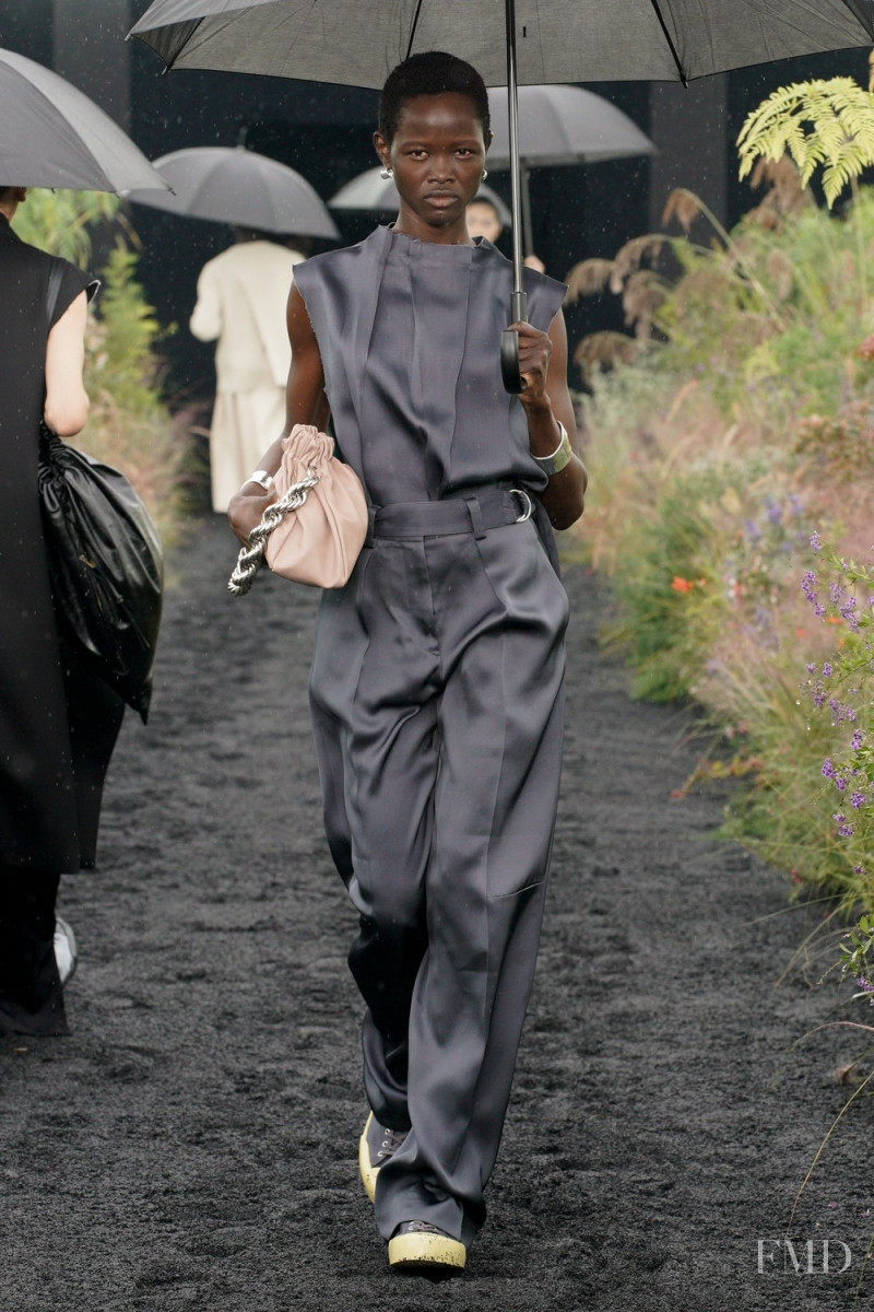 Anyiel Majok featured in  the Jil Sander fashion show for Spring/Summer 2023