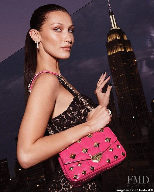 Bella Hadid featured in  the Michael Kors Collection MK Soho advertisement for Holiday 2021