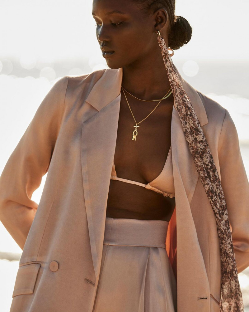 Abeny Nhial featured in  the Shona Joy lookbook for Resort 2022