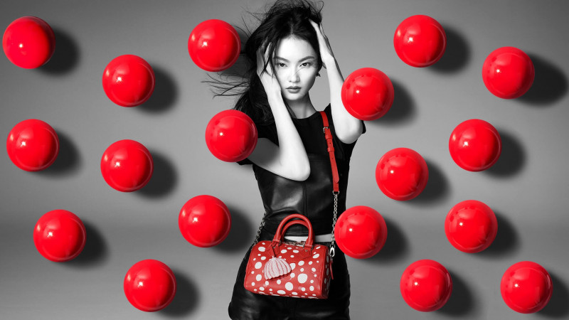 Cong He featured in  the Louis Vuitton Louis Vuitton x Yayoi Kusama Global Campaign advertisement for Holiday 2022