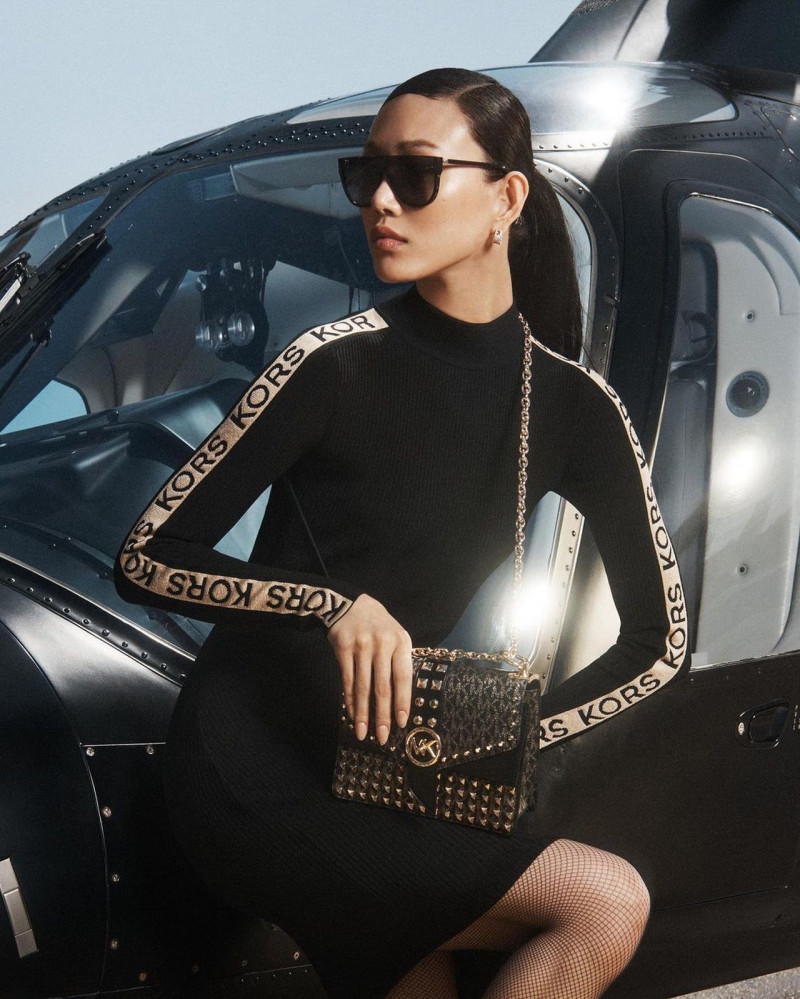 So Ra Choi featured in  the Michael Kors Collection advertisement for Holiday 2022