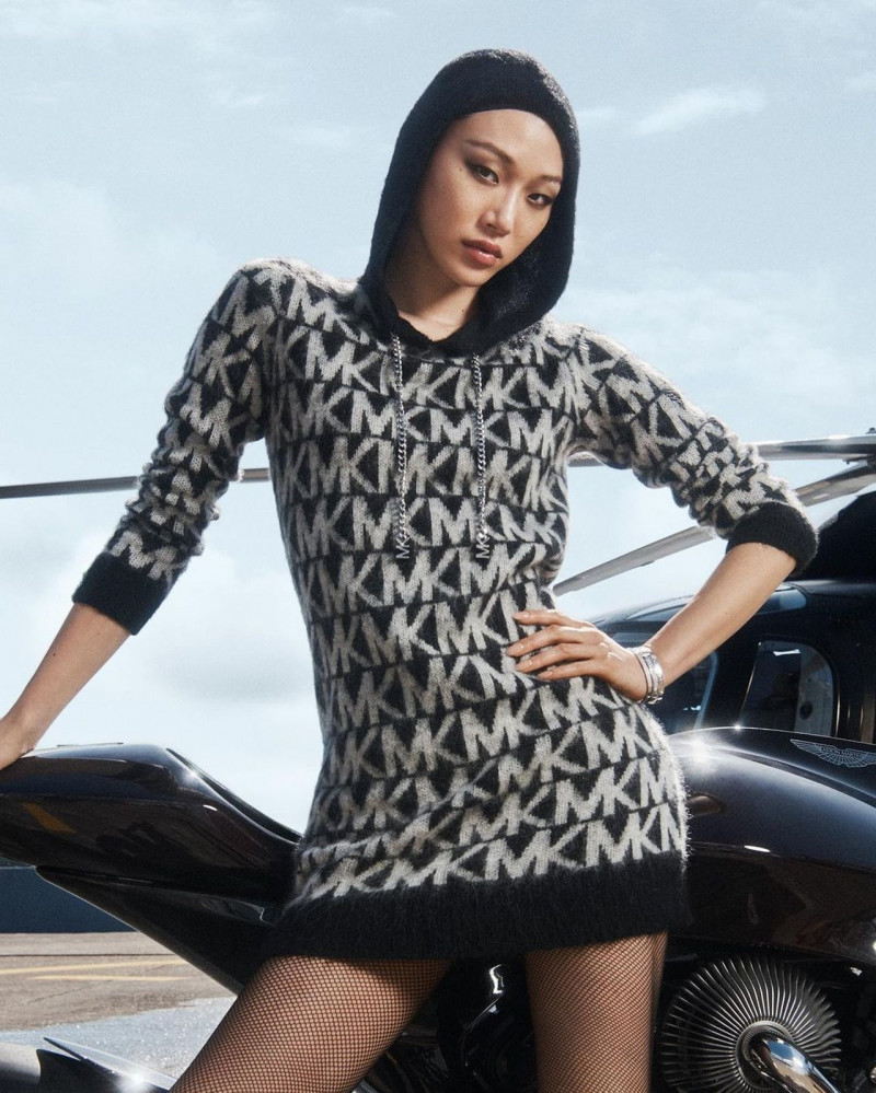 So Ra Choi featured in  the Michael Kors Collection advertisement for Holiday 2022