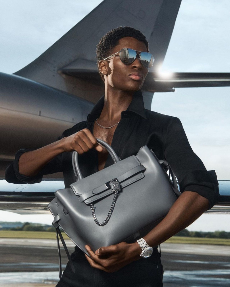 Alton Mason featured in  the Michael Kors Collection advertisement for Holiday 2022