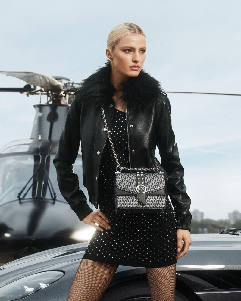 Felice Noordhoff featured in  the Michael Kors Collection advertisement for Holiday 2022