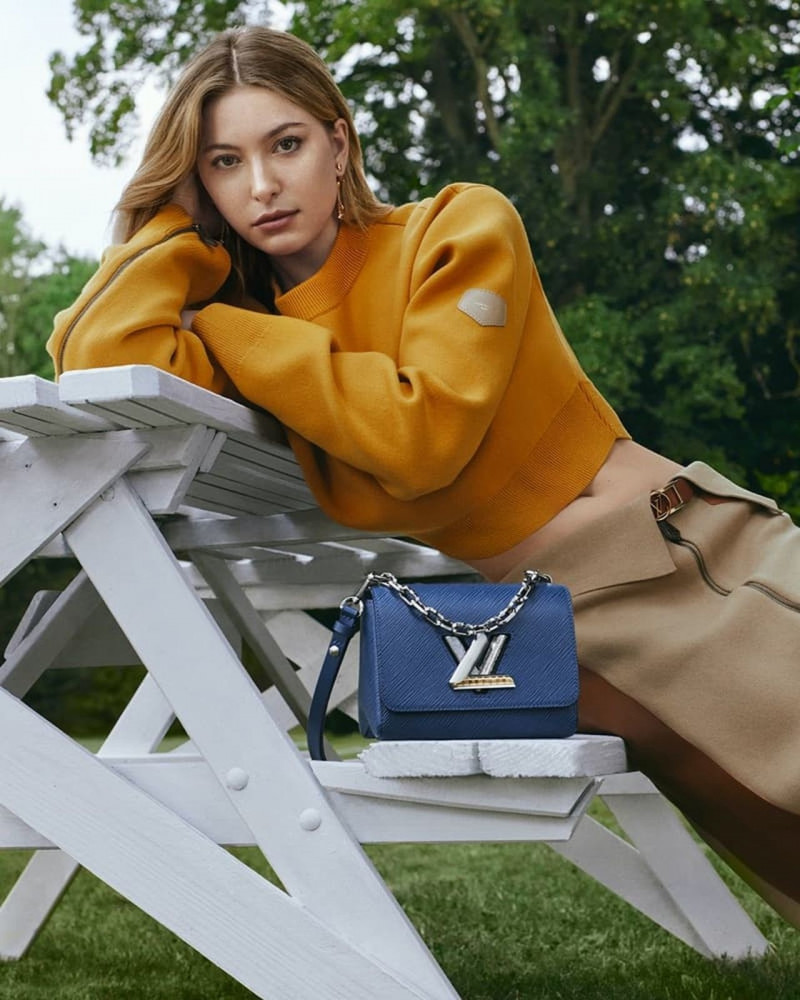 Eve Jobs featured in  the Louis Vuitton Twist Bag advertisement for Winter 2022