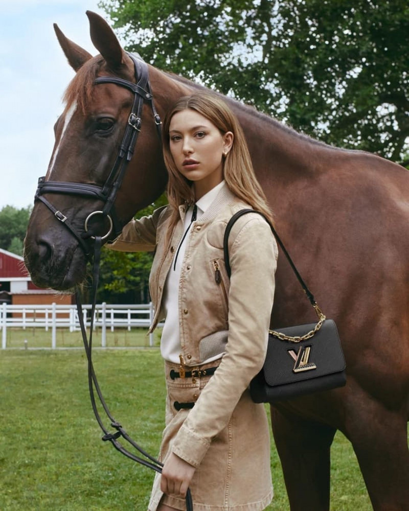 Eve Jobs featured in  the Louis Vuitton Twist Bag advertisement for Winter 2022