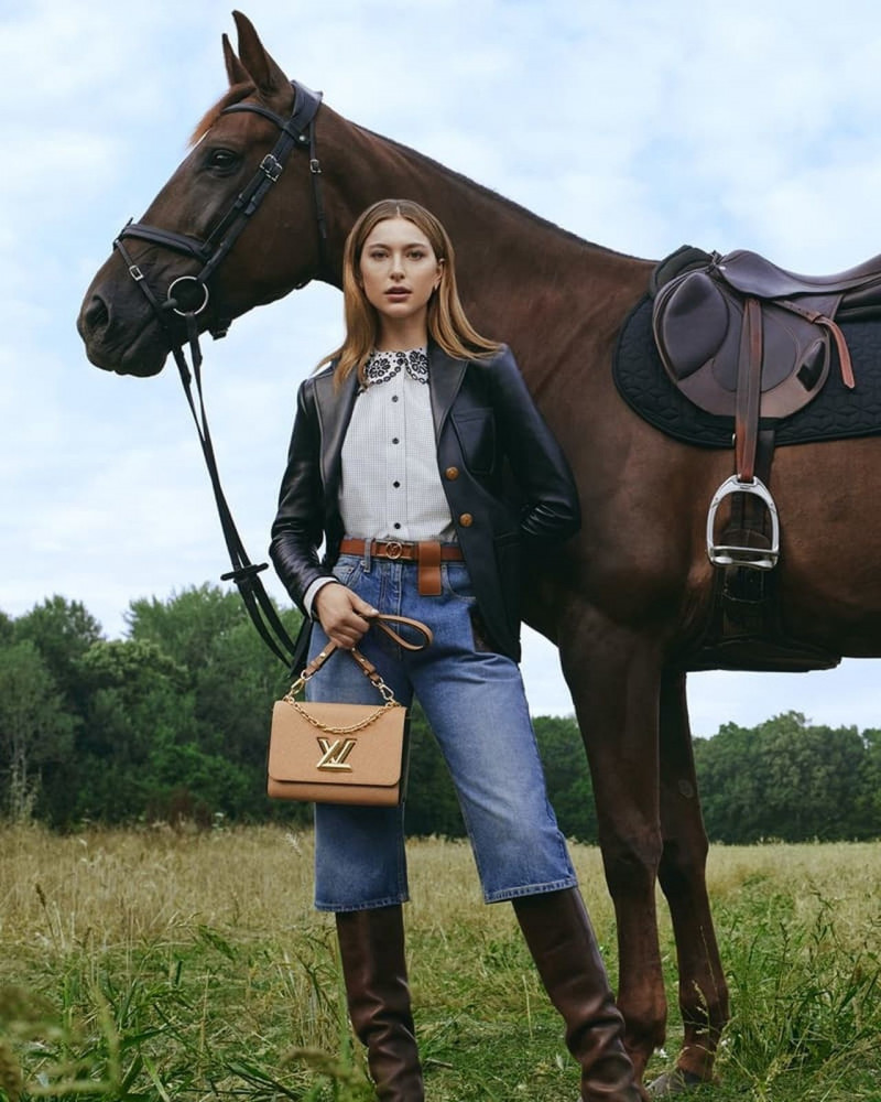 Eve Jobs featured in  the Louis Vuitton Twist Bag advertisement for Winter 2022