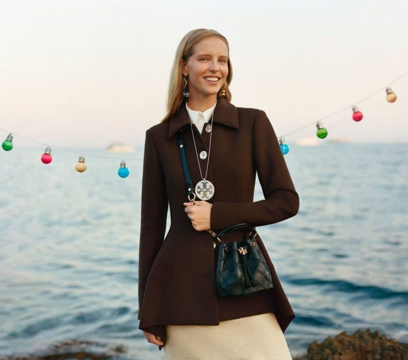 Abby Champion featured in  the Tory Burch advertisement for Holiday 2022