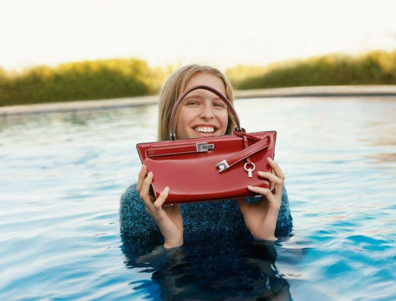 Abby Champion featured in  the Tory Burch advertisement for Holiday 2022