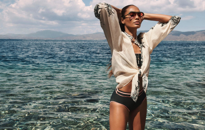 Joan Smalls featured in  the Zimmermann Swim advertisement for Resort 2022