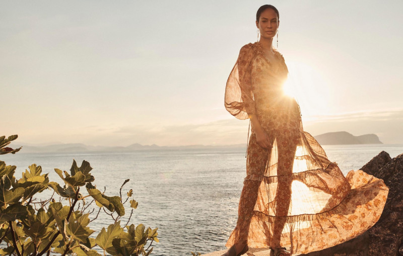 Joan Smalls featured in  the Zimmermann Swim advertisement for Resort 2022