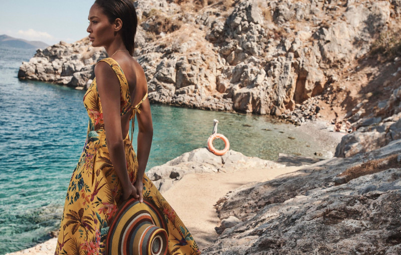 Joan Smalls featured in  the Zimmermann Swim advertisement for Resort 2022