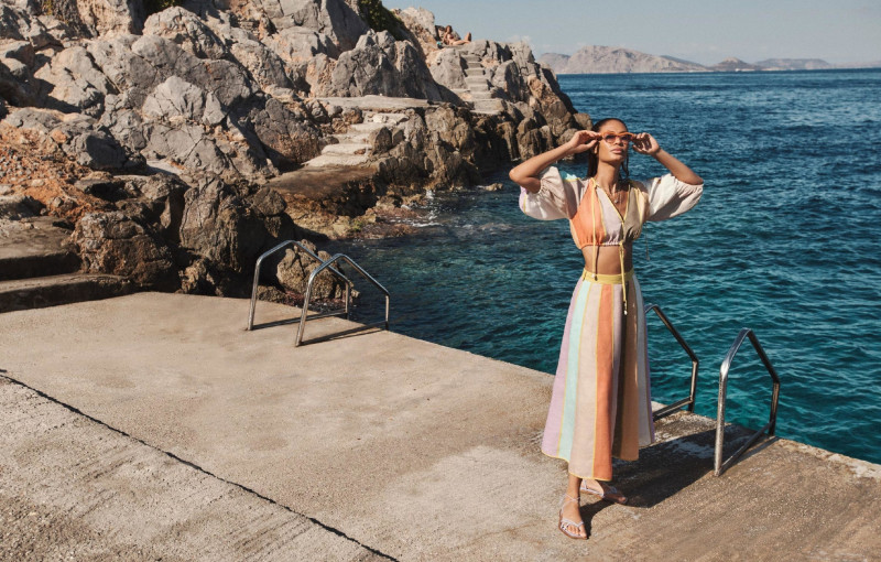 Joan Smalls featured in  the Zimmermann Swim advertisement for Resort 2022