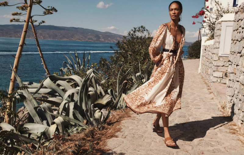 Joan Smalls featured in  the Zimmermann Swim advertisement for Resort 2022