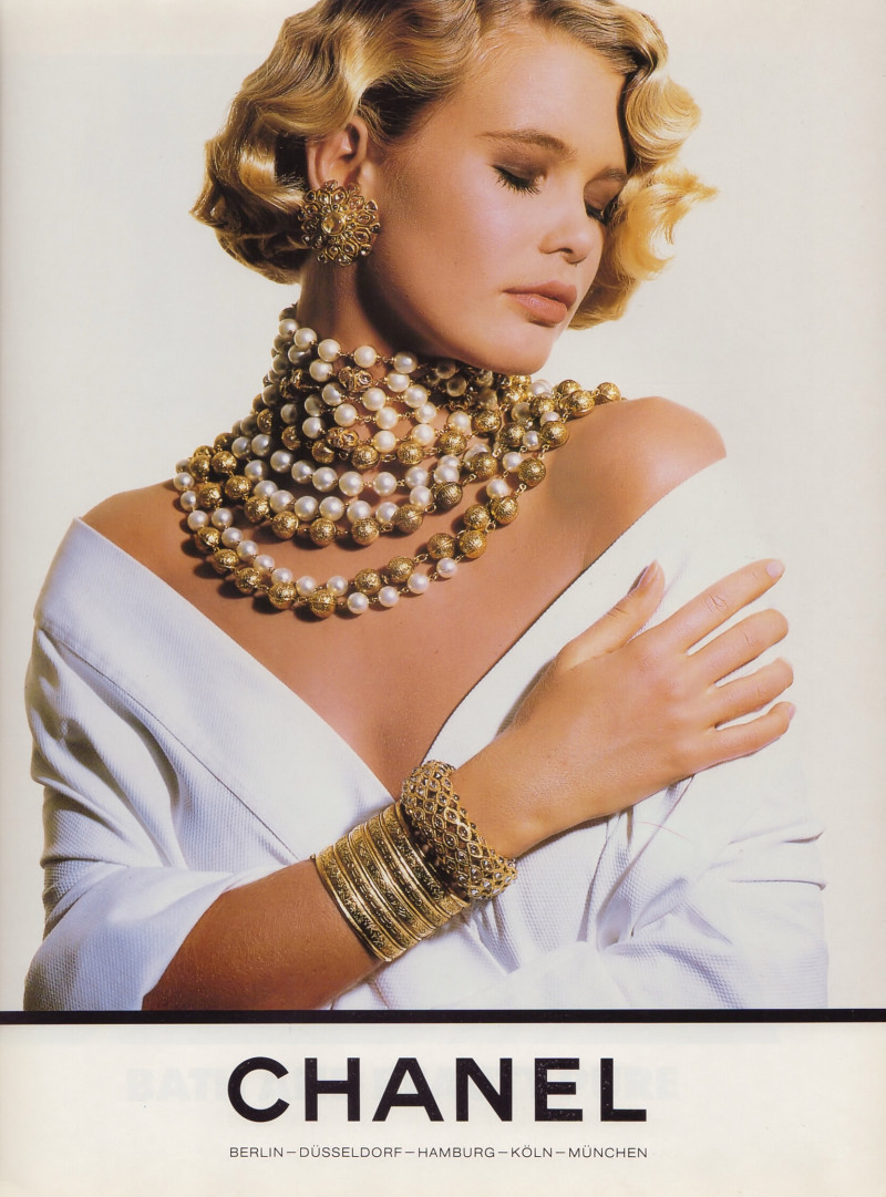 Claudia Schiffer featured in  the Chanel advertisement for Spring/Summer 1990