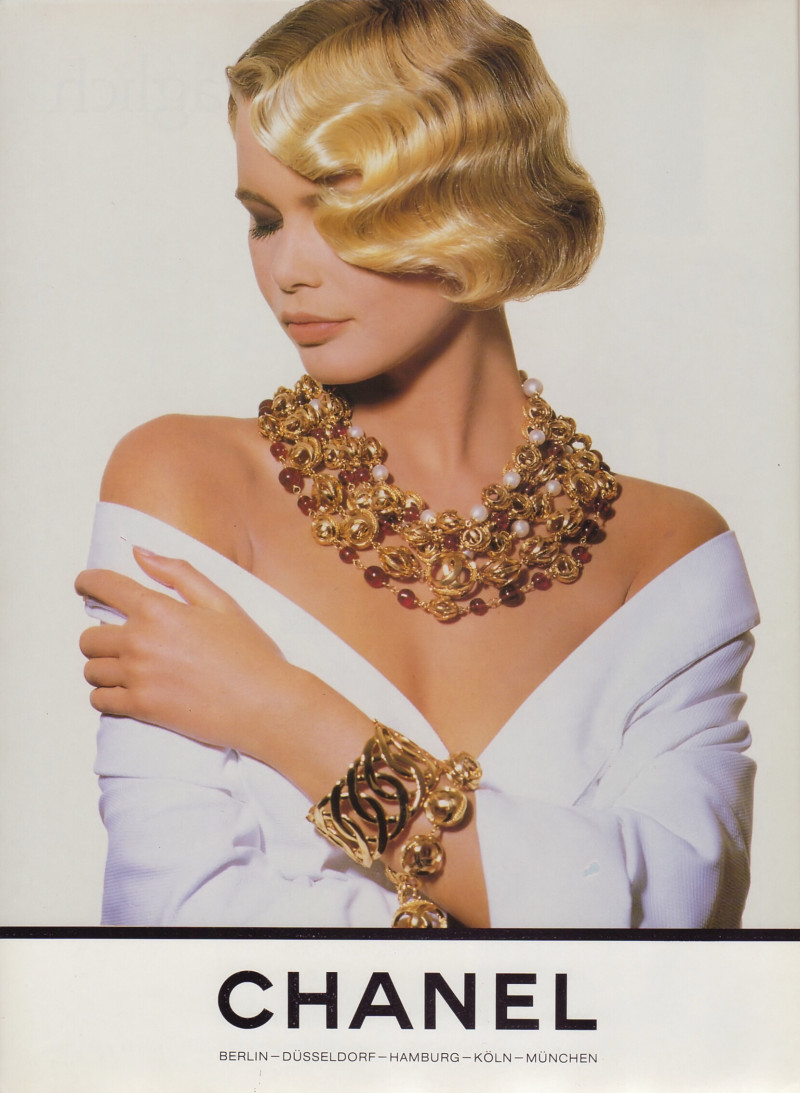 Claudia Schiffer featured in  the Chanel advertisement for Spring/Summer 1990