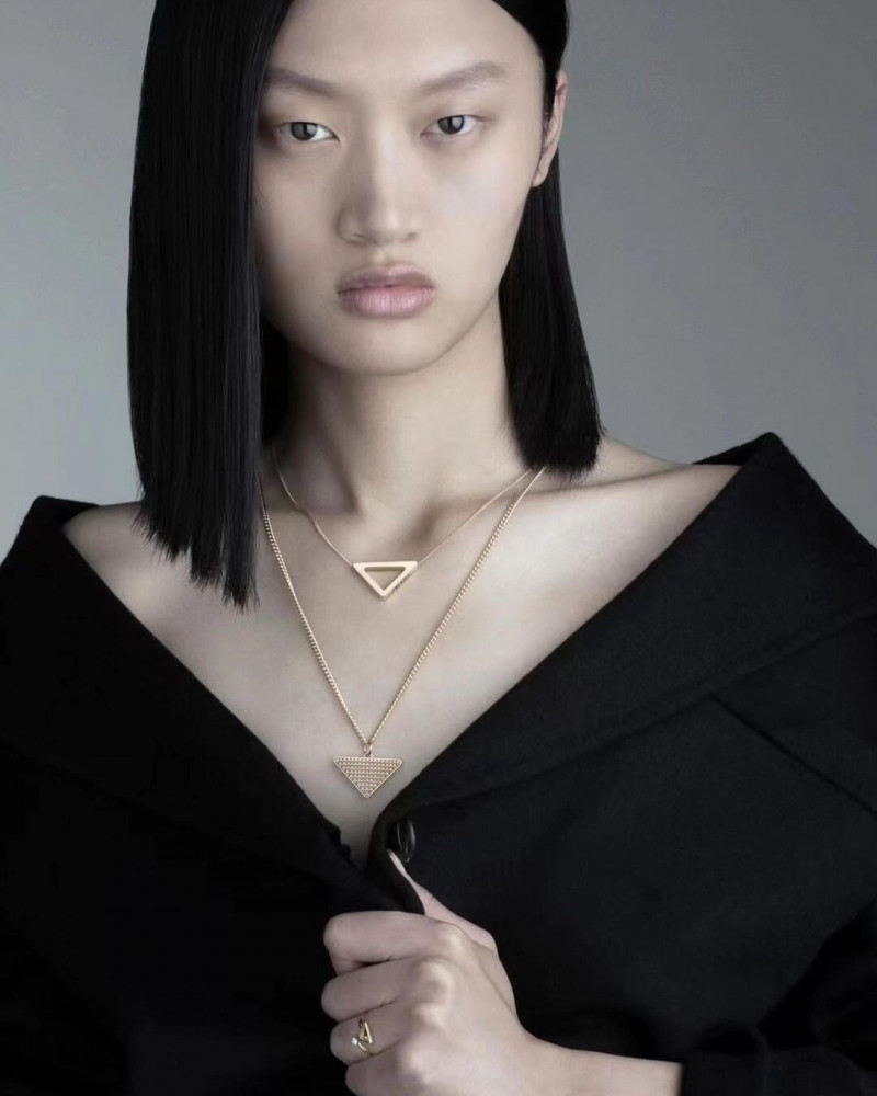 Yilan Hua featured in  the Prada Fine Jewellery advertisement for Winter 2021