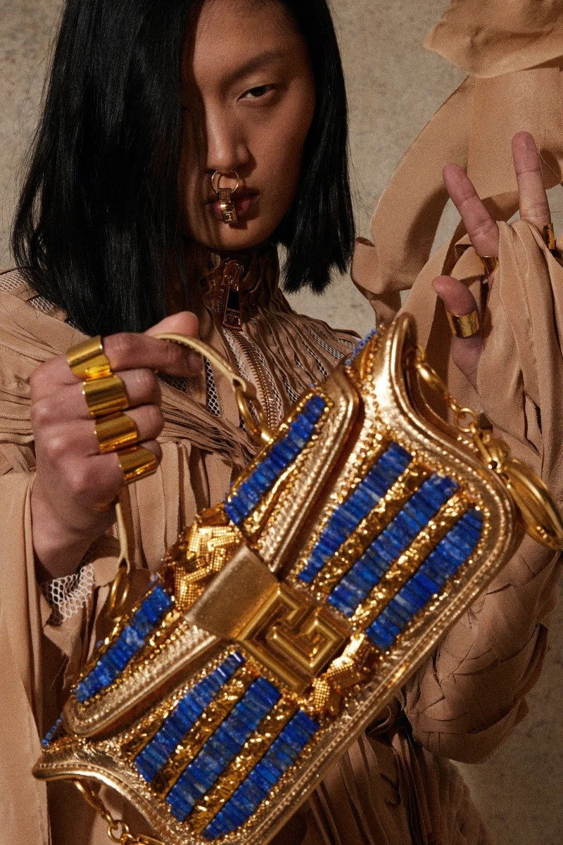 Yilan Hua featured in  the Balmain lookbook for Resort 2023