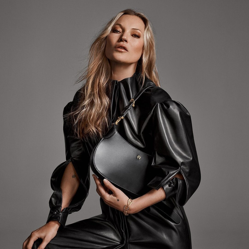 Kate Moss featured in  the Aigner Progress advertisement for Autumn/Winter 2022