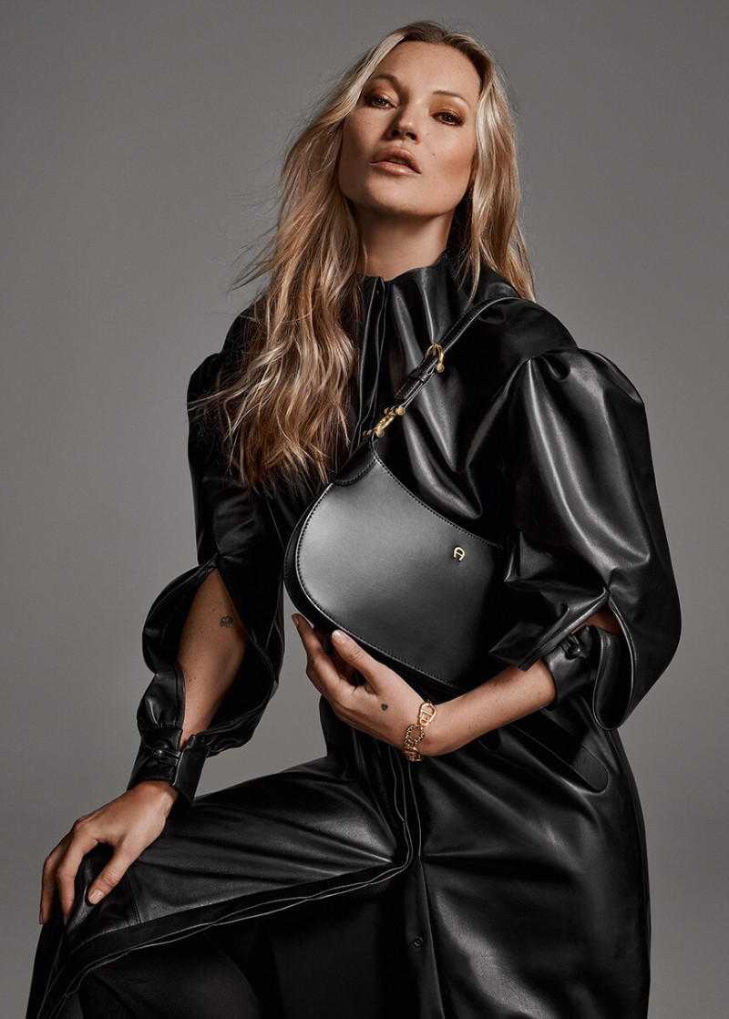 Kate Moss featured in  the Aigner Progress advertisement for Autumn/Winter 2022